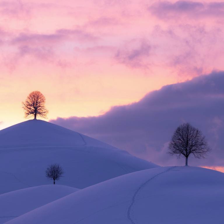Sunset over snowy mountains