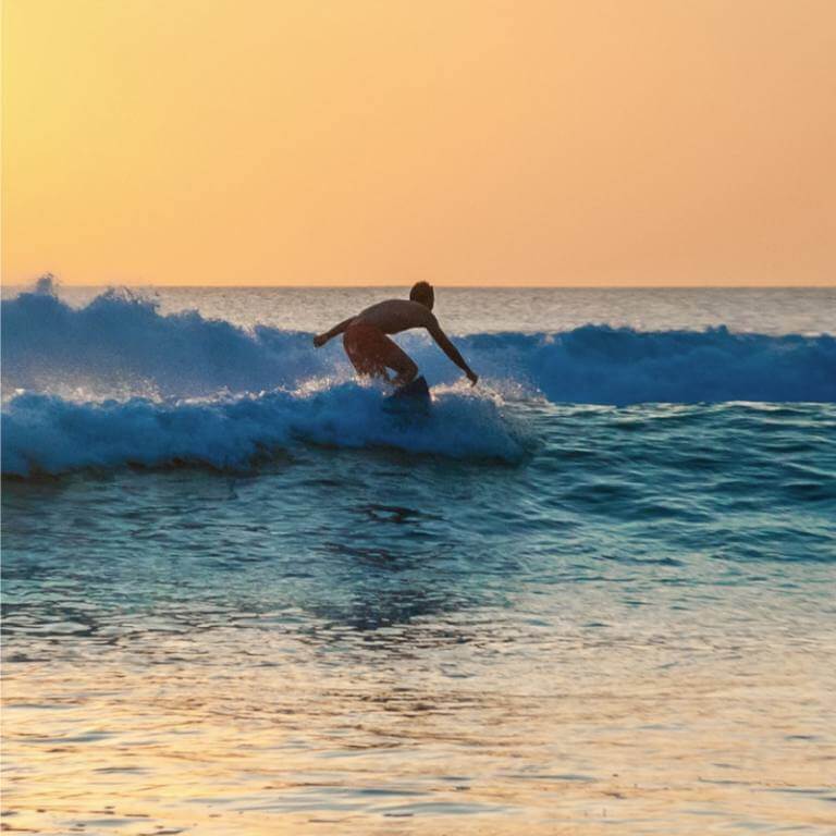 Surfer by the water